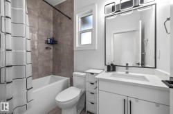 Full bathroom with shower / bathtub combination with curtain and vanity - 