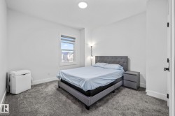 Carpeted bedroom featuring baseboards - 