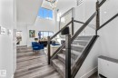 Stairs with a high ceiling, healthy amount of natural light, and wood finished floors - 5304 Kimball Place, Edmonton, AB  - Indoor Photo Showing Other Room 