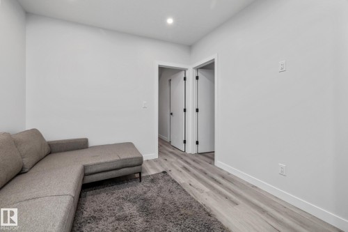Living area featuring light wood-style floors and recessed lighting - 5304 Kimball Place, Edmonton, AB - Indoor