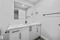 Bathroom featuring vanity and baseboards - 