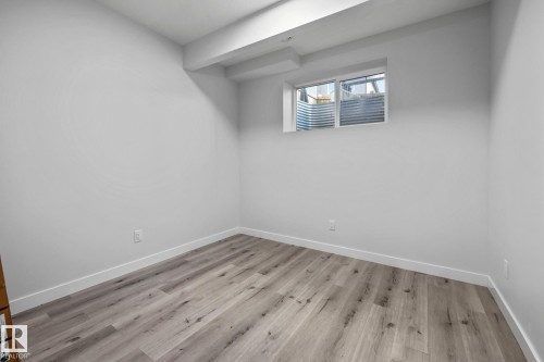Below grade area featuring light wood finished floors - 5304 Kimball Place, Edmonton, AB - Indoor Photo Showing Other Room