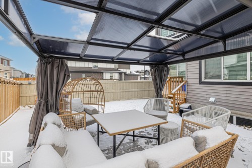 Fenced backyard featuring an outdoor hangout area and a patio area - 5304 Kimball Place, Edmonton, AB - Outdoor With Deck Patio Veranda With Exterior