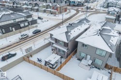 Snowy aerial view featuring a residential view - 
