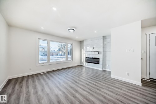 14505 23 Street Nw, Edmonton, AB - Indoor Photo Showing Living Room With Fireplace