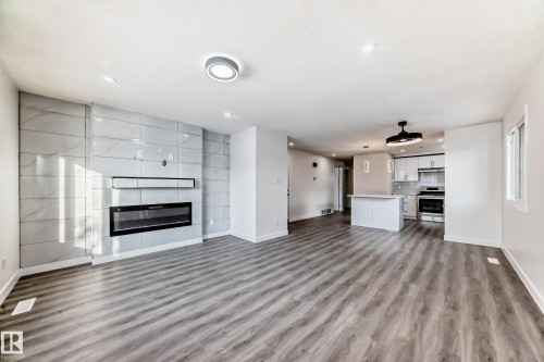14505 23 Street Nw, Edmonton, AB - Indoor Photo Showing Living Room With Fireplace