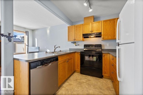 84 16823 84 Street, Edmonton, AB - Indoor Photo Showing Kitchen With Double Sink