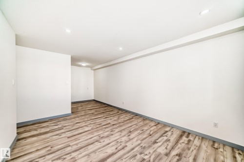 Empty room with light wood-type flooring and baseboards - 4B 13230 Fort Road, Edmonton, AB - Indoor Photo Showing Other Room