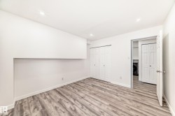 Unfurnished bedroom featuring light wood-style flooring, a closet, washer / clothes dryer, and recessed lighting - 
