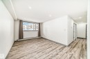 Unfurnished room with a baseboard radiator, light wood-style floors, and recessed lighting - 4B 13230 Fort Road, Edmonton, AB  - Indoor Photo Showing Other Room 