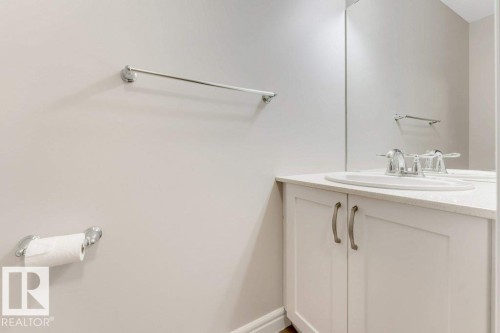Bathroom featuring vanity and baseboards - 1423 24 Street, Edmonton, AB - Indoor Photo Showing Bathroom