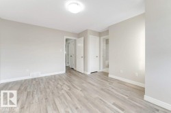 Unfurnished room featuring baseboards and light wood-type flooring - 