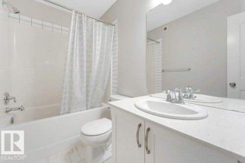 Full bath featuring vanity and shower / bathtub combination with curtain - 1423 24 Street, Edmonton, AB - Indoor Photo Showing Bathroom