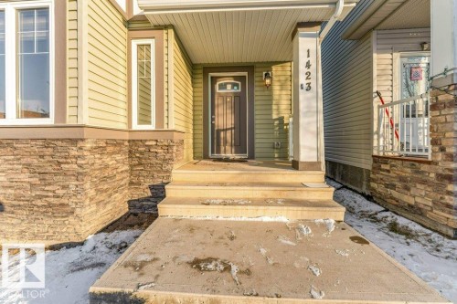 View of exterior entry with stone siding - 1423 24 Street, Edmonton, AB - Outdoor