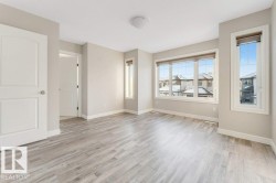 Empty room featuring baseboards and light wood-type flooring - 