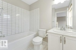 Bathroom with vanity and shower / washtub combination - 
