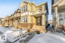 View of front of home featuring stone siding and a residential view - 1423 24 Street, Edmonton, AB  - Outdoor With Facade 