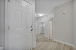 Hallway with baseboards and light wood-type flooring - 