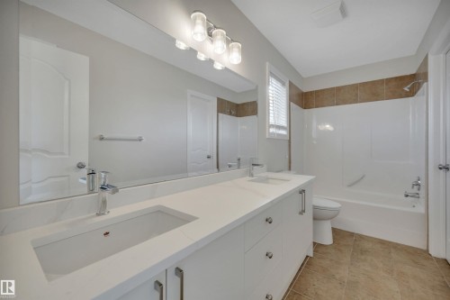 Bathroom with double vanity and shower / tub combination - 457 Aster Close, Leduc, AB - Indoor Photo Showing Bathroom
