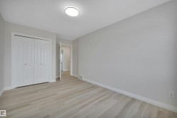 Unfurnished bedroom with light wood-type flooring and a closet - 
