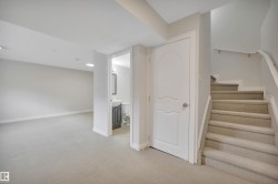 Staircase featuring carpet flooring - 