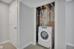 Washroom with washer / dryer and carpet floors - 