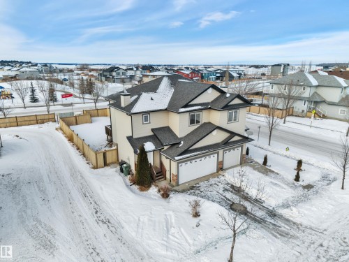 Snowy aerial view featuring a residential view - 457 Aster Close, Leduc, AB - Outdoor