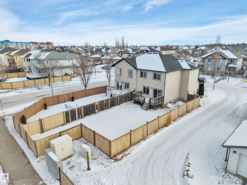 Snowy aerial view featuring a residential view - 457 Aster Close, Leduc, AB - Outdoor