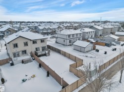 Snowy aerial view featuring a residential view - 