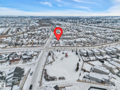 Snowy aerial view with a residential view - 457 Aster Close, Leduc, AB - Outdoor With View