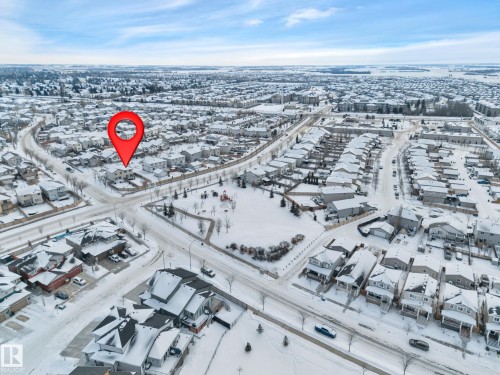 Snowy aerial view featuring a residential view - 457 Aster Close, Leduc, AB - Outdoor With View