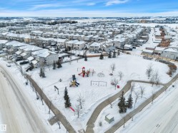 Snowy aerial view featuring a residential view - 