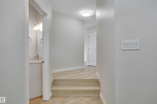 Stairway with baseboards - 457 Aster Close, Leduc, AB - Indoor Photo Showing Other Room