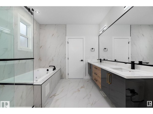 Full bath with double vanity, a bath, light marble finish floors, and recessed lighting - 138 South Ravines Drive, Devon, AB - Indoor