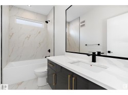 Full bathroom with vanity, tub / shower combination, and light marble finish flooring - 