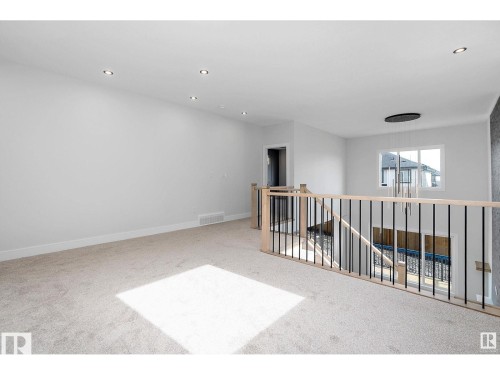 Spare room with light carpet and recessed lighting - 138 South Ravines Drive, Devon, AB - Indoor Photo Showing Other Room