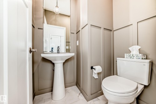Bathroom featuring toilet and marble finish flooring - 3249 Dixon Way, Edmonton, AB - Indoor Photo Showing Bathroom