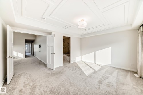 Unfurnished room featuring light colored carpet and baseboards - 3249 Dixon Way, Edmonton, AB - Indoor Photo Showing Other Room