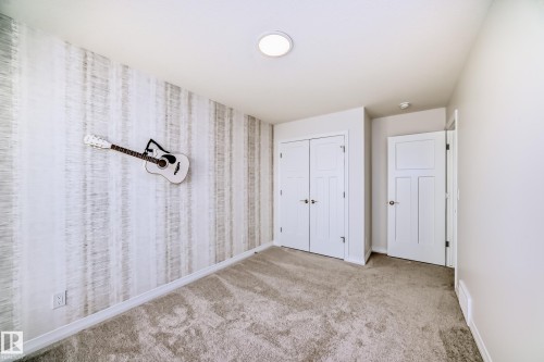 Unfurnished bedroom featuring carpet and a closet - 3249 Dixon Way, Edmonton, AB - Indoor