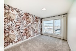 Empty room with carpet floors and a water view - 