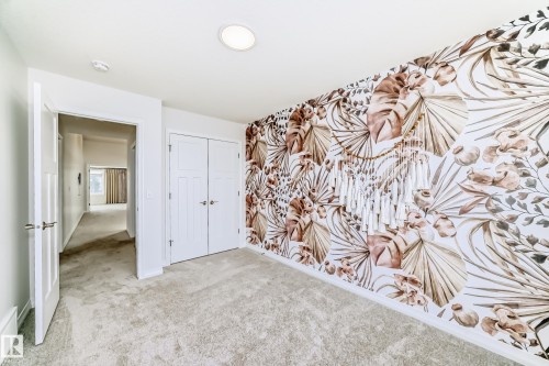 Unfurnished bedroom featuring carpet flooring and a closet - 3249 Dixon Way, Edmonton, AB - Indoor Photo Showing Other Room