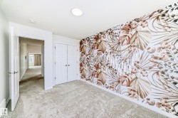 Unfurnished bedroom featuring carpet flooring and a closet - 