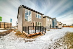 Snow covered house featuring a deck - 