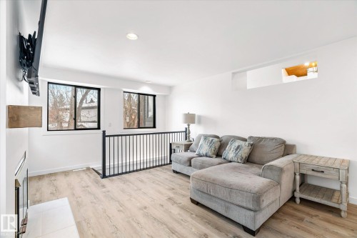 Living area with recessed lighting, light wood finished floors, and a fireplace - 38 Woodcrest Avenue, St. Albert, AB - Indoor