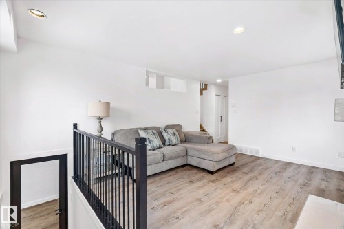 Living area with light wood-style floors, recessed lighting, and stairs - 38 Woodcrest Avenue, St. Albert, AB - Indoor