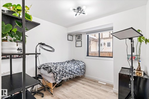 Bedroom featuring light wood finished floors and baseboards - 38 Woodcrest Avenue, St. Albert, AB - Indoor Photo Showing Gym Room