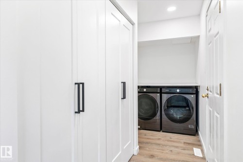 Laundry room featuring light wood finished floors, washing machine and dryer, and recessed lighting - 38 Woodcrest Avenue, St. Albert, AB - Indoor Photo Showing Laundry Room