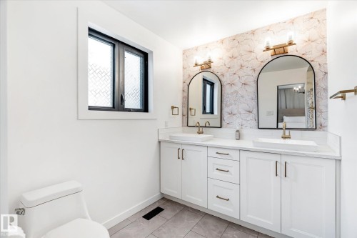 Full bath featuring double vanity and wallpapered walls - 38 Woodcrest Avenue, St. Albert, AB - Indoor Photo Showing Bathroom