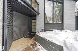 View of exterior entry featuring brick siding - 