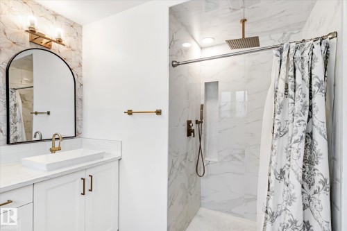 Full bath featuring a marble finish shower and vanity - 38 Woodcrest Avenue, St. Albert, AB - Indoor Photo Showing Bathroom